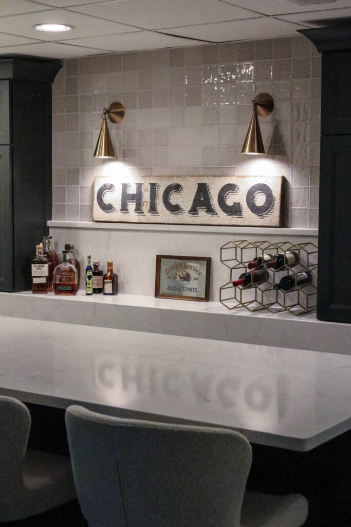 Finished basement remodel with custom bar seating, brass hardware, MSI Valentine countertop.