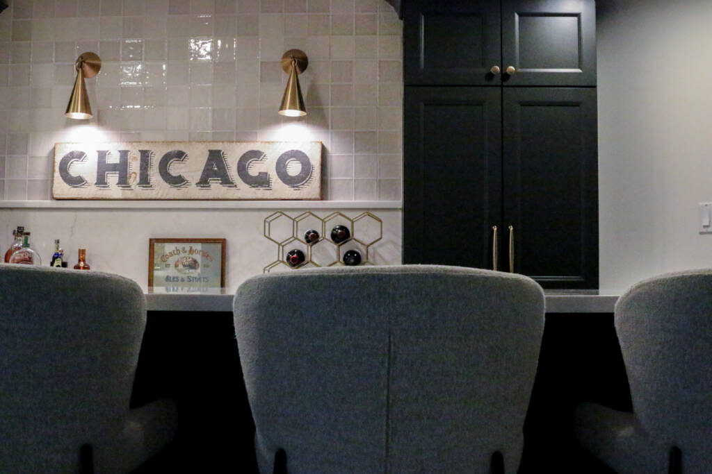Finished basement remodel with custom bar seating, brass hardware, MSI Valentine countertop.