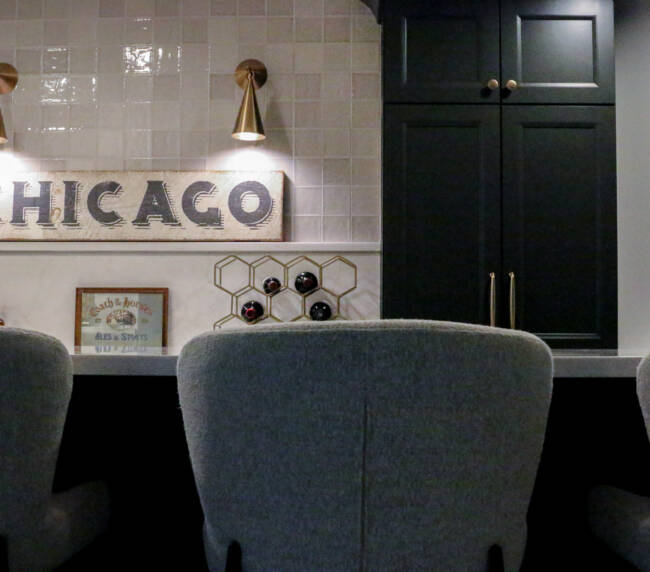 Finished basement remodel with custom bar seating, brass hardware, MSI Valentine countertop.