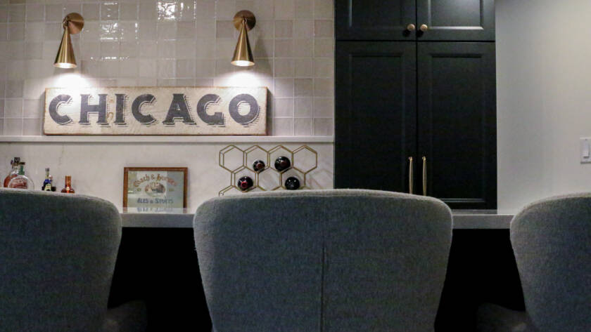 Finished basement remodel with custom bar seating, brass hardware, MSI Valentine countertop.