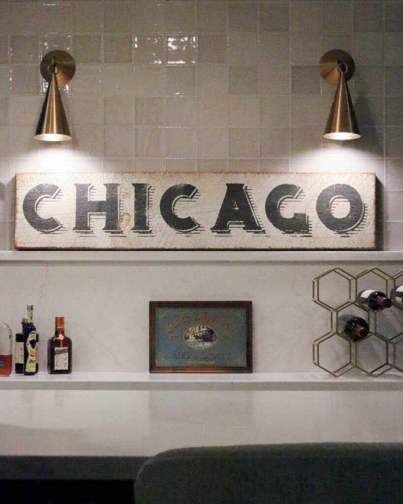 Finished basement remodel with custom bar seating, brass hardware, MSI Valentine countertop.