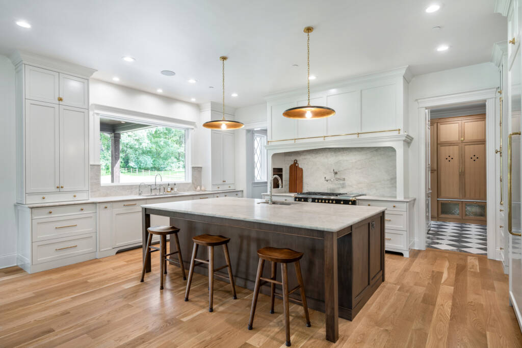 A view of large family kitchen with taj majal quartzite countertops and oversized island.