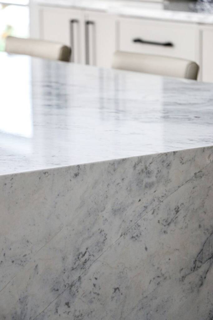 Closeup of marble waterfall island in naperville luxury marble kitchen