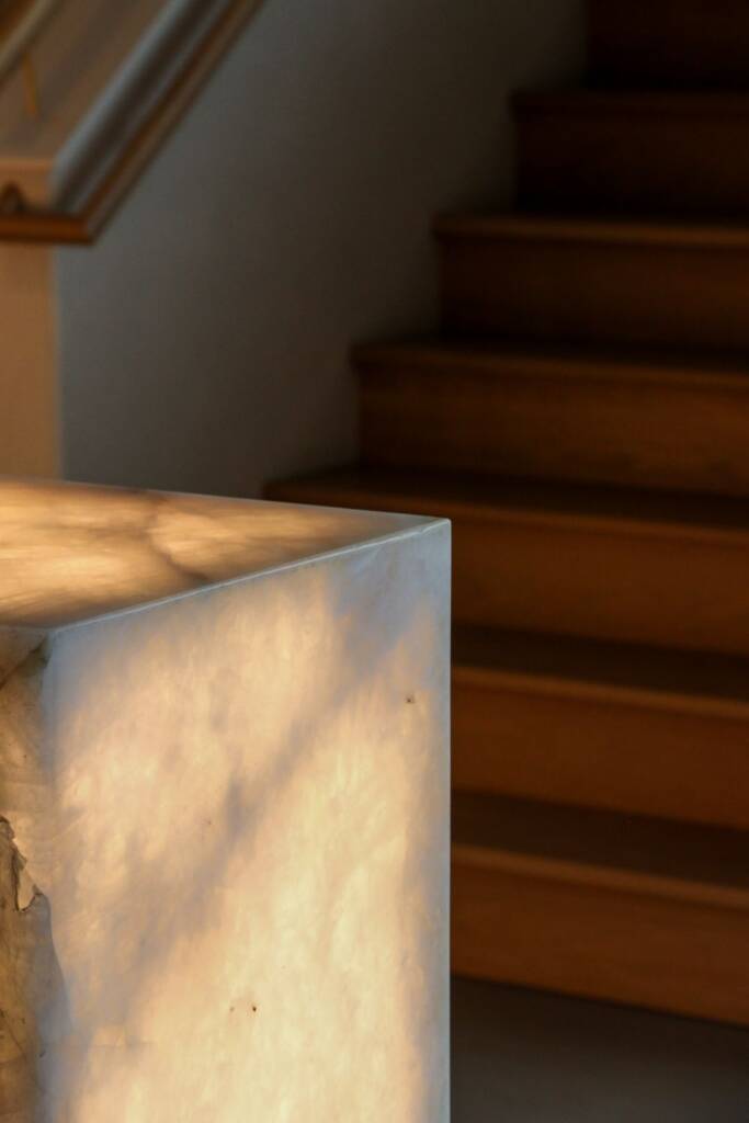 Closeup of backlit crystallo quartzite reception desk at jem spa