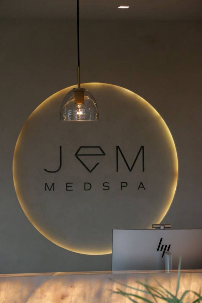 Backlit crystallo quartzite reception desk at jem spa