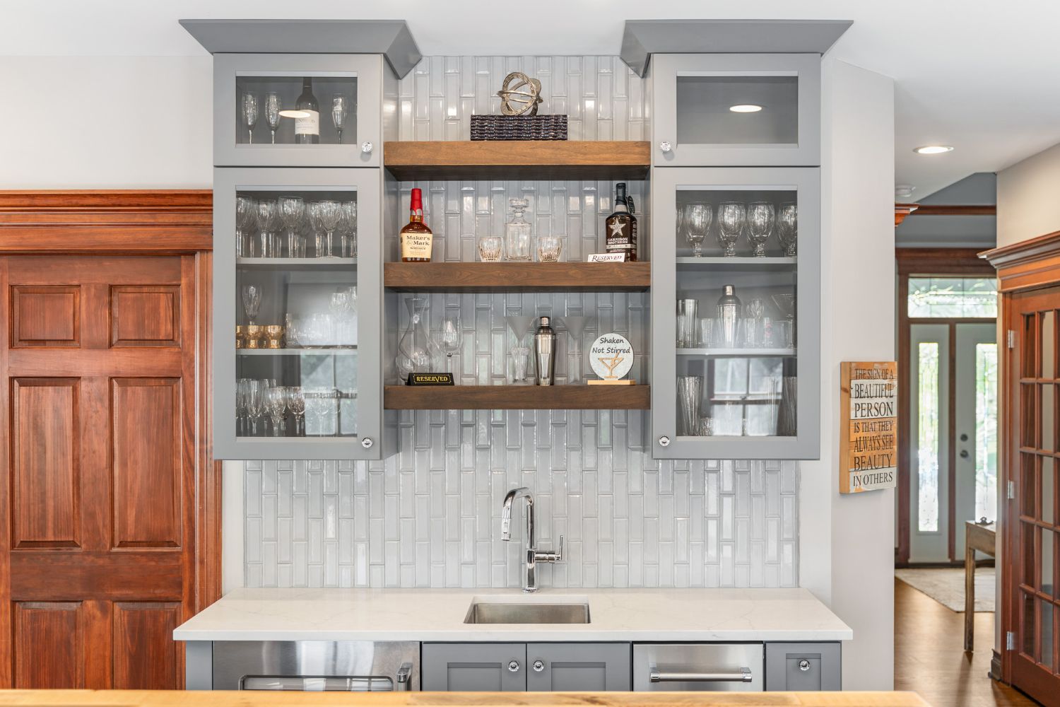 Kitchen remodel with grey cabinets and quartz countertops wet bar