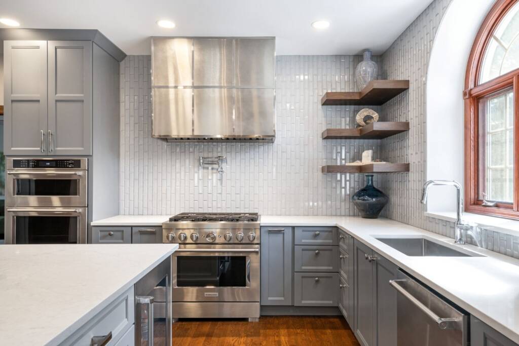 Kitchen remodel with grey cabinets and quartz countertops
