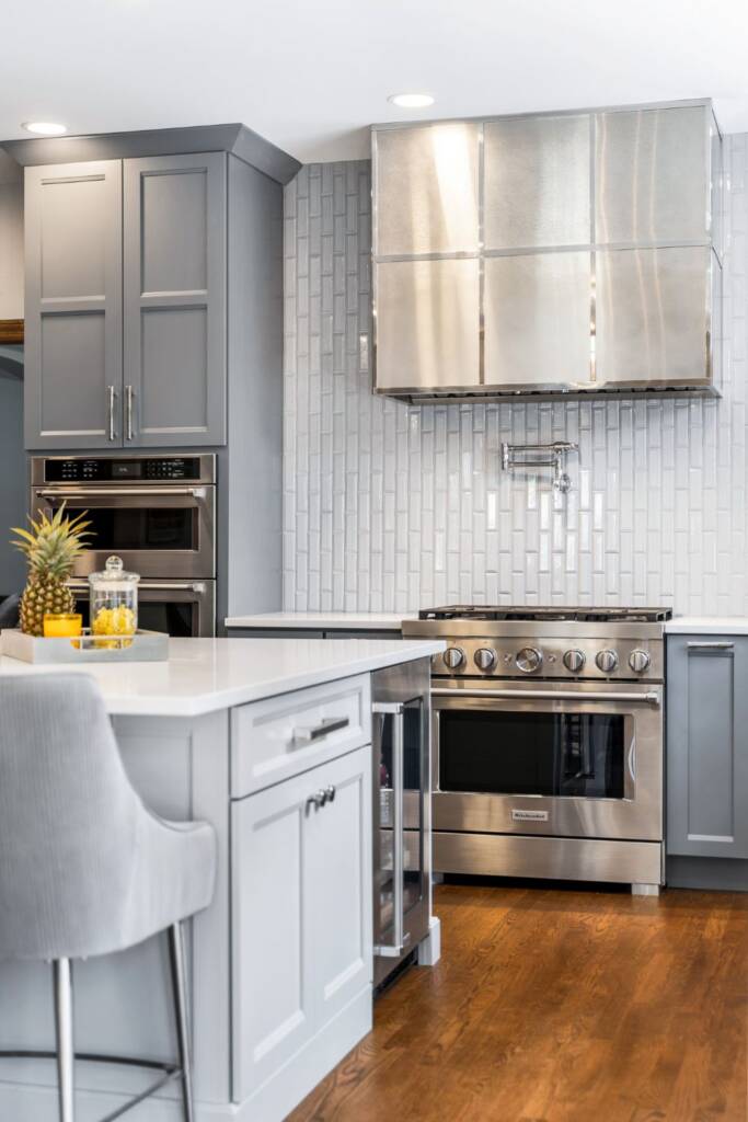 Kitchen remodel with grey cabinets and quartz countertops
