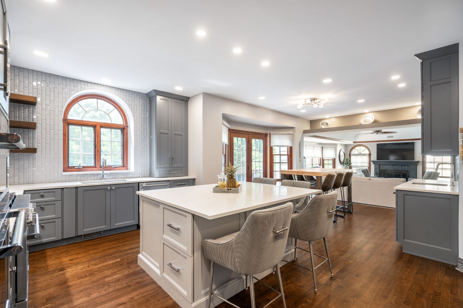 Kitchen remodel with grey cabinets and quartz countertops