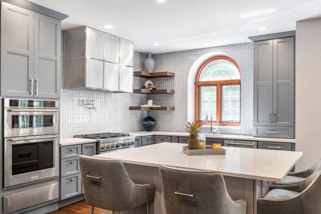 Kitchen remodel with grey cabinets and quartz countertops