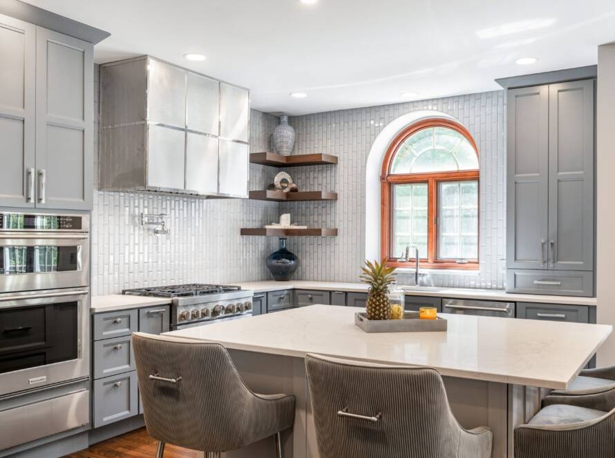 Kitchen remodel with grey cabinets and quartz countertops